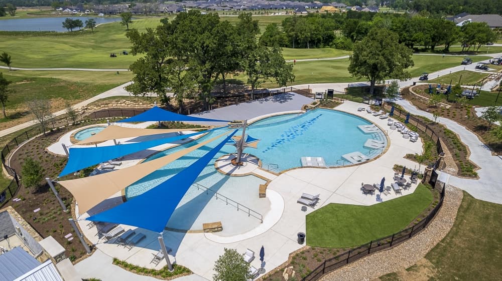 Resort-style pool and hot tub at Chambers Creek active adult community near Lake Conroe. 