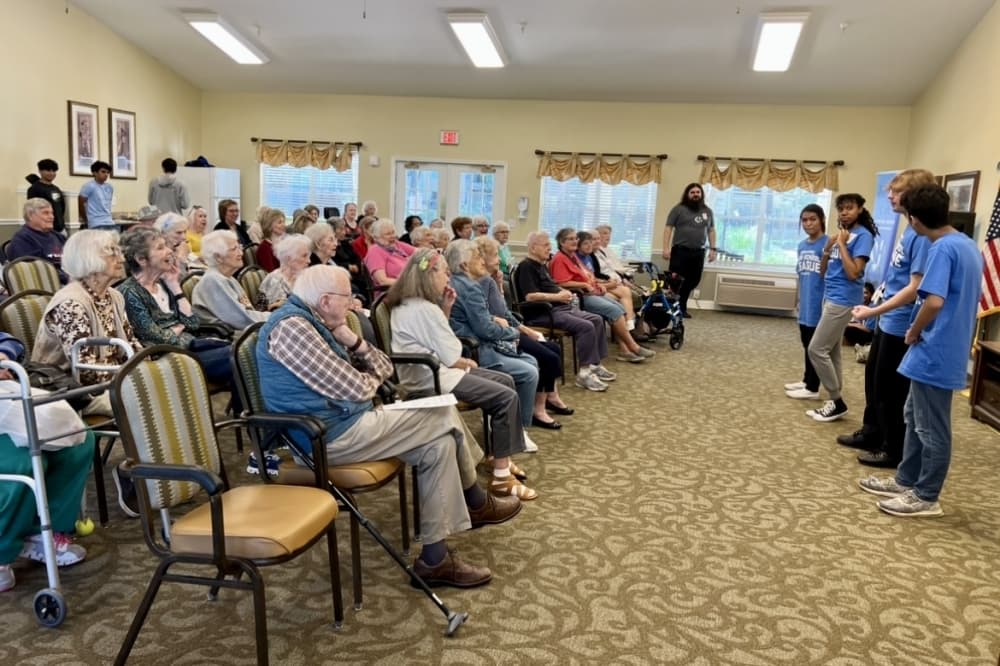 Teenagers who volunteer with Silver Heart Care's youth team visit different local nursing homes to connect and serve the residents living there. (Courtesy Silver Heart Care)