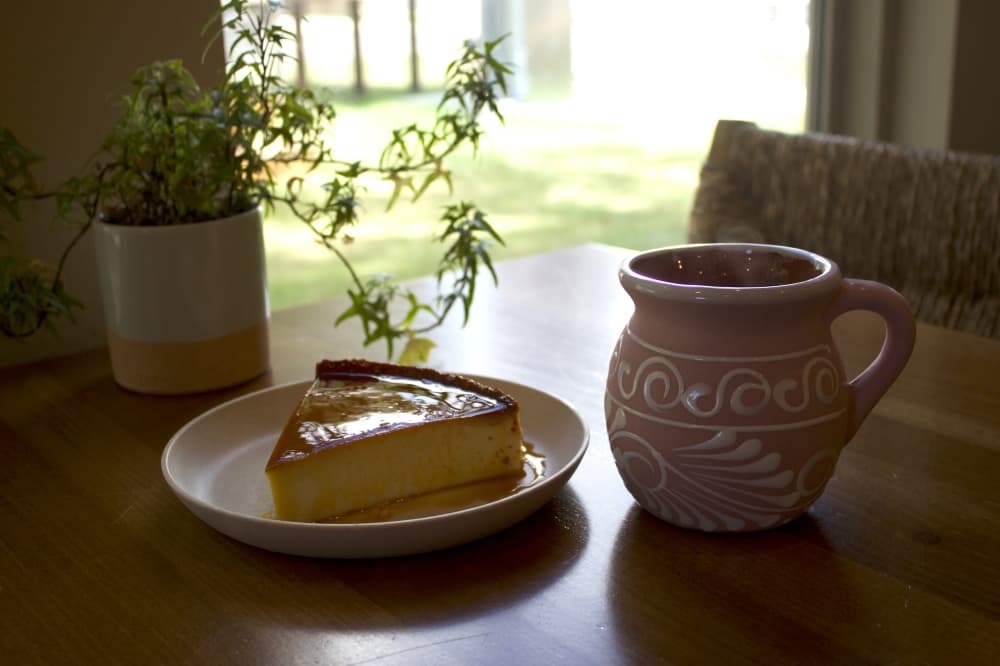 Mi Ranchito recently added champurrado to their menu, which is a traditional Mexican drink similar to hot chocolate. It is pictured above with a piece of flan, a custard dessert. (Sienna Wight/Community Impact)