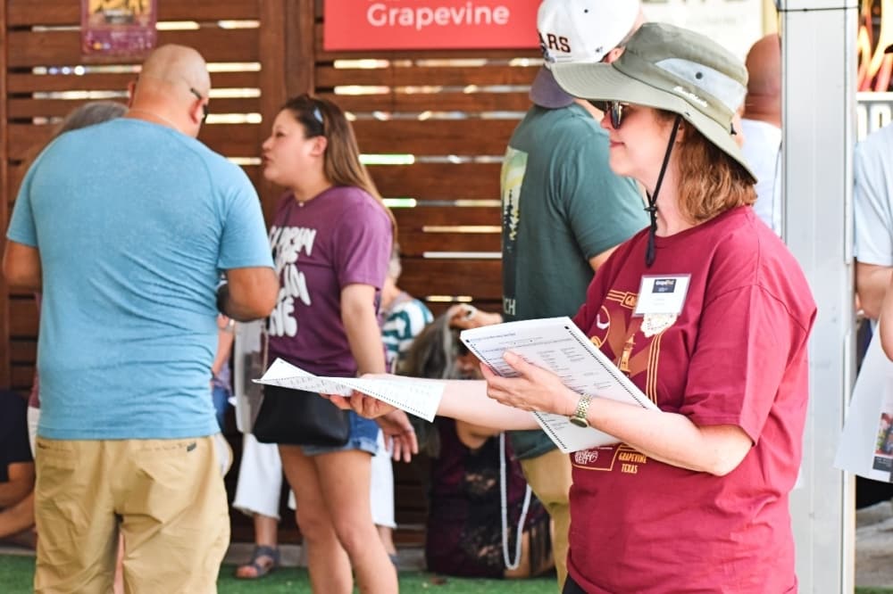 volunteer passing out form 