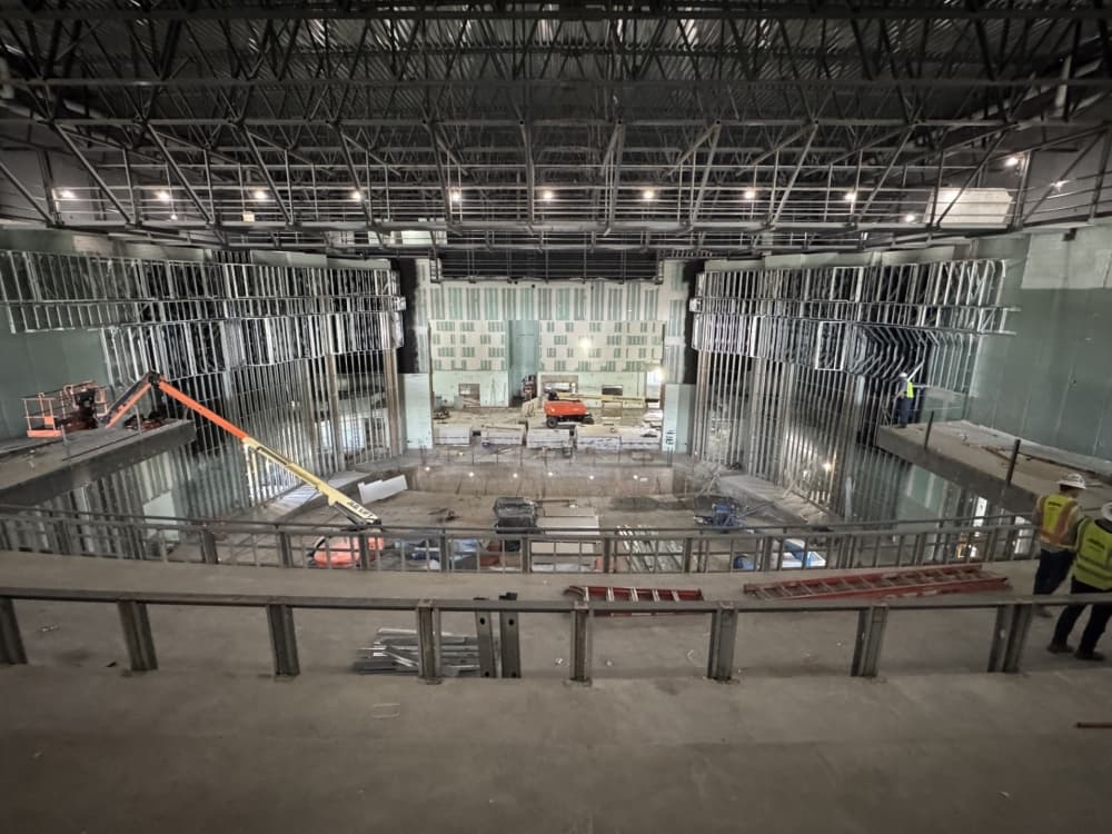 the interior of a performance hall while under active construction