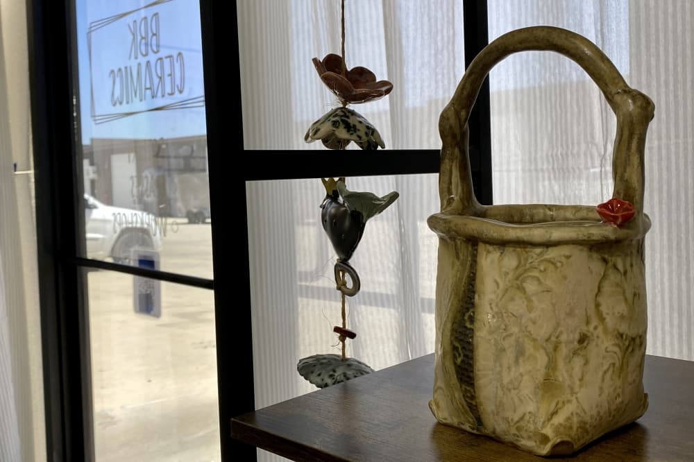 Kelleher keeps student work and example items at the front of the studio. She said she loves helping others live out their creative clay journey. (Katlynn Fox/Community Impact)