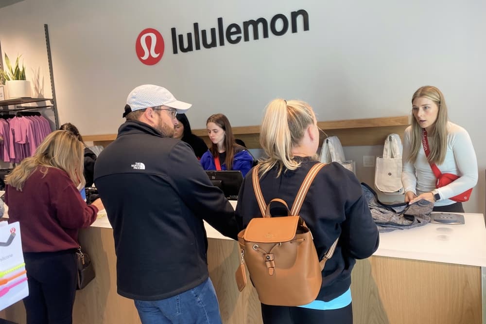 Customers at Lululemon's cashier