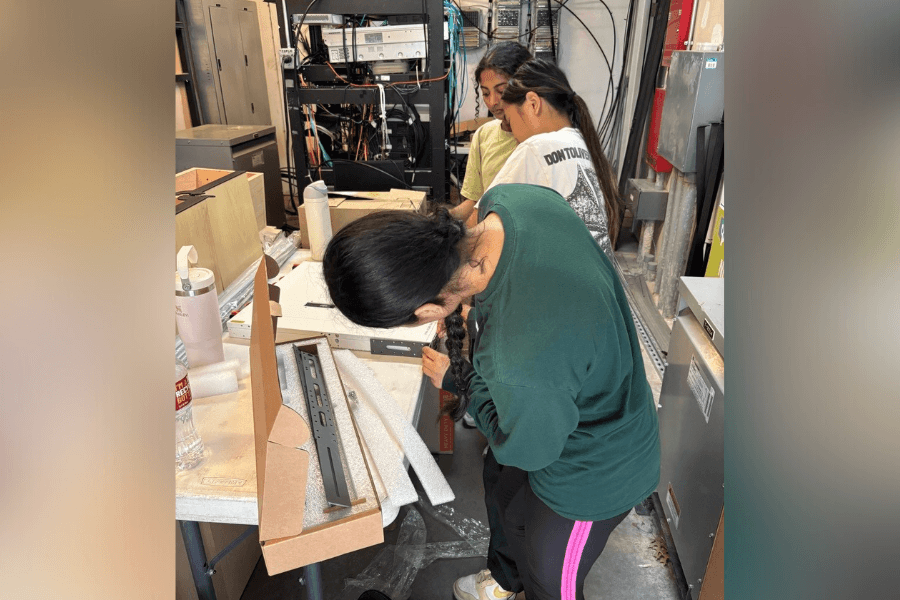Frisco ISD students and Reliable Technology team members installing Wi-Fi access points at Riders Field as part of the RoughRiders’ stadium technology upgrade.