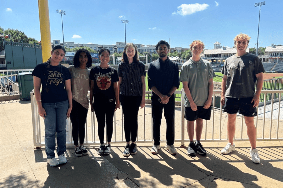 Fans enjoying a Frisco RoughRiders game at Riders Field after the stadium’s high-tech network upgrade by Reliable Technology, featuring faster Wi-Fi and stronger cybersecurity.