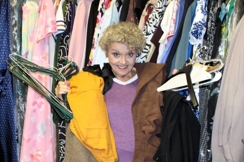 Richardson Theatre Centre Artistic Director Rachael Lindley helps out in the costume department. (Karen Chaney/Community Impact)