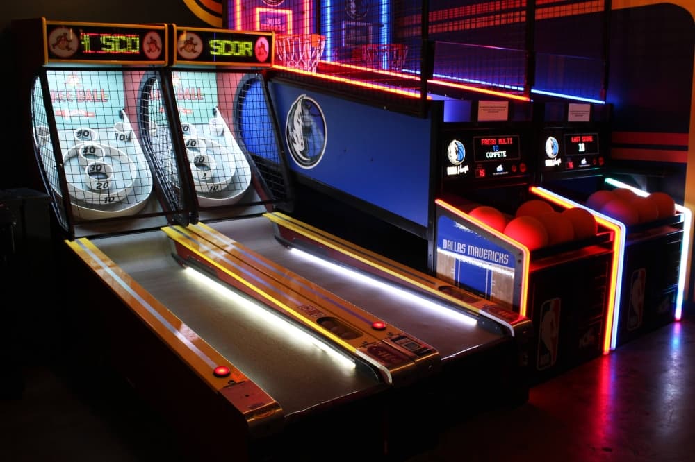 Two skee ball games in an arcade. 