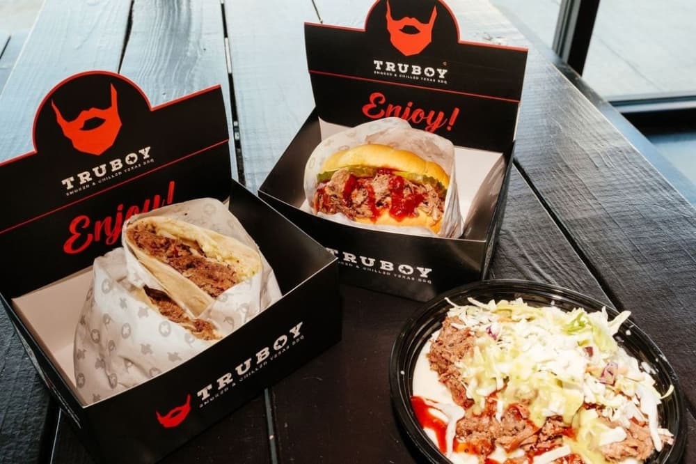 three barbecue entrees on a table