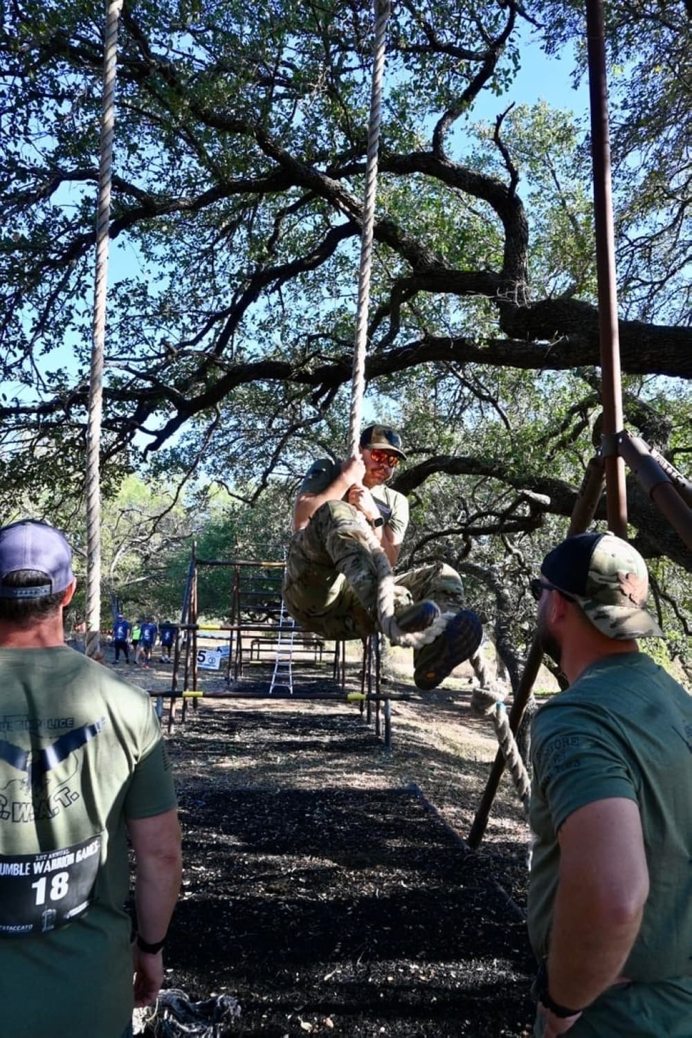 man climbing rope