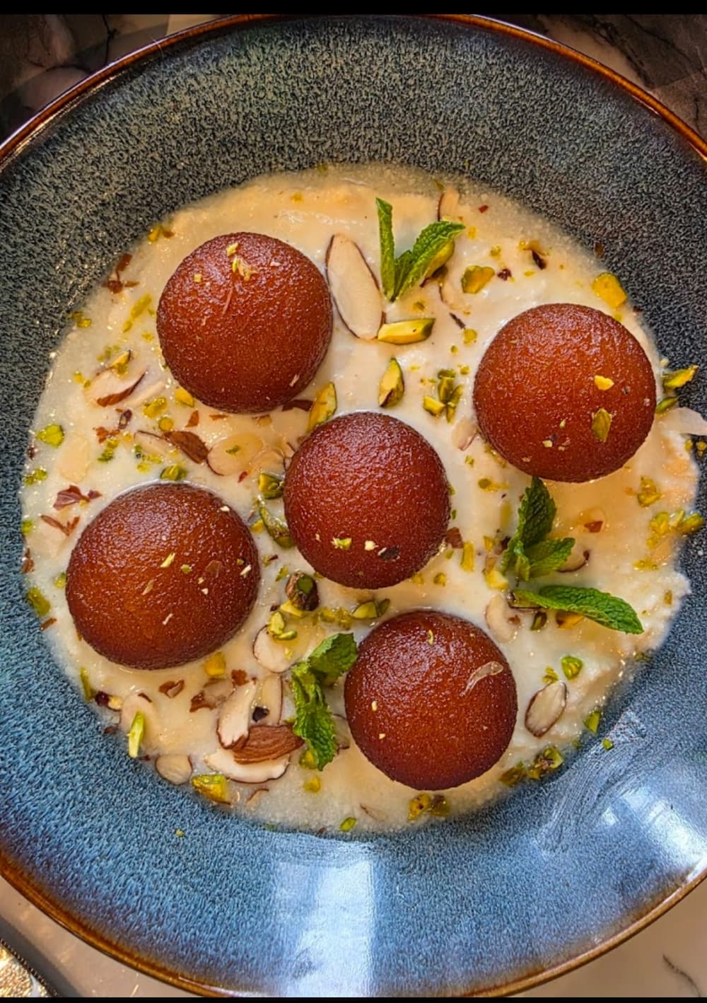 Desserts served include Gulab Jamun with Rabdi for $6.99. (Courtesy Tikka House)