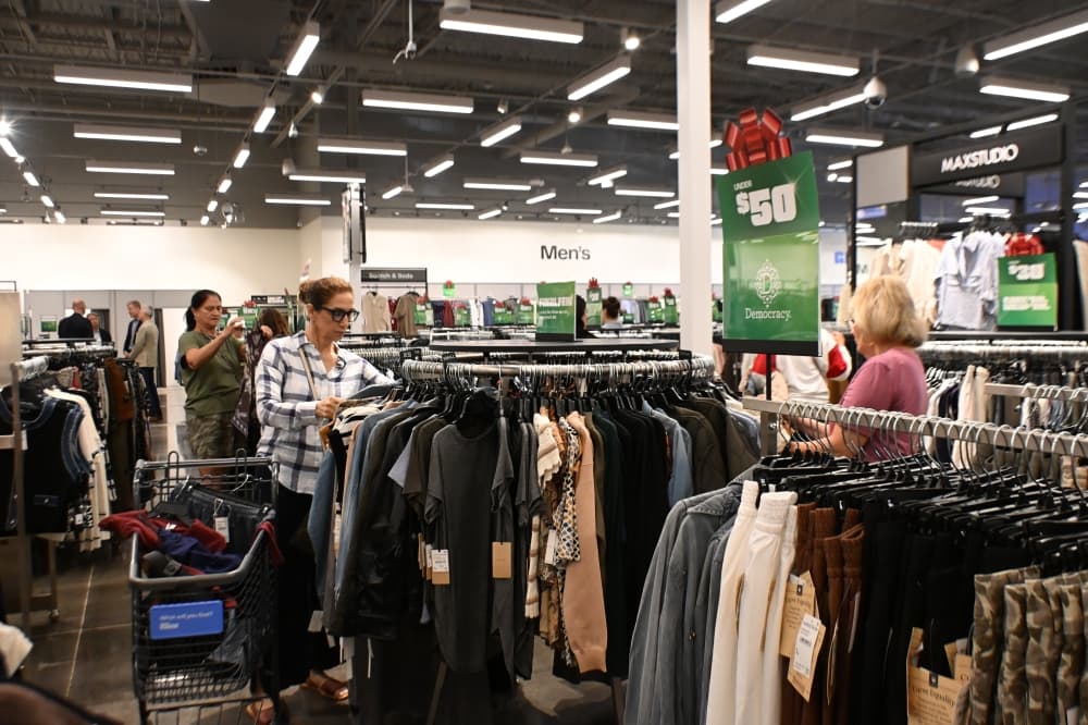 Customers shop within a clothing section at the Flower Mound Nordstrom Rack on the day of its grand opening, Oct. 9.