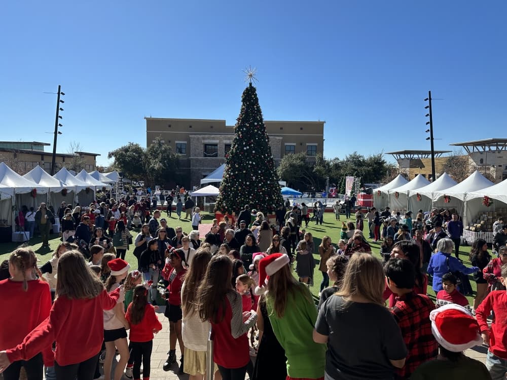 people at festive holiday farmers market