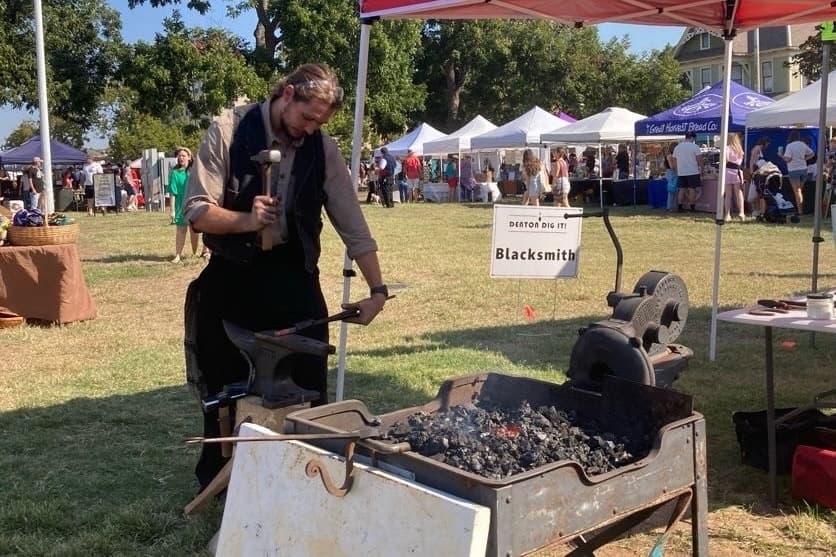 a person at a fair outside