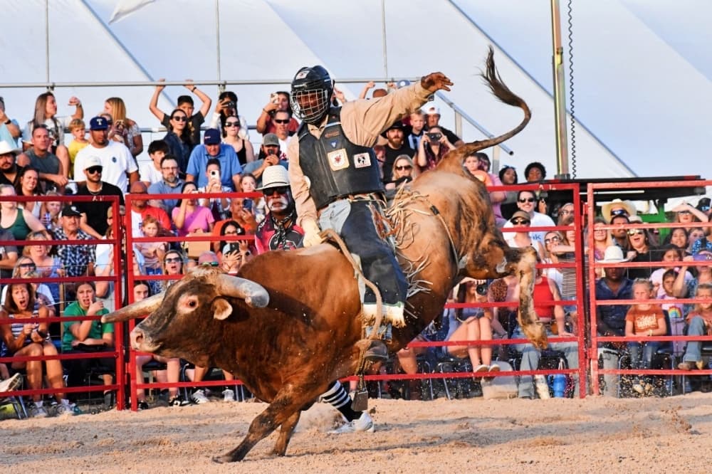 man riding a bull in Roanoke 