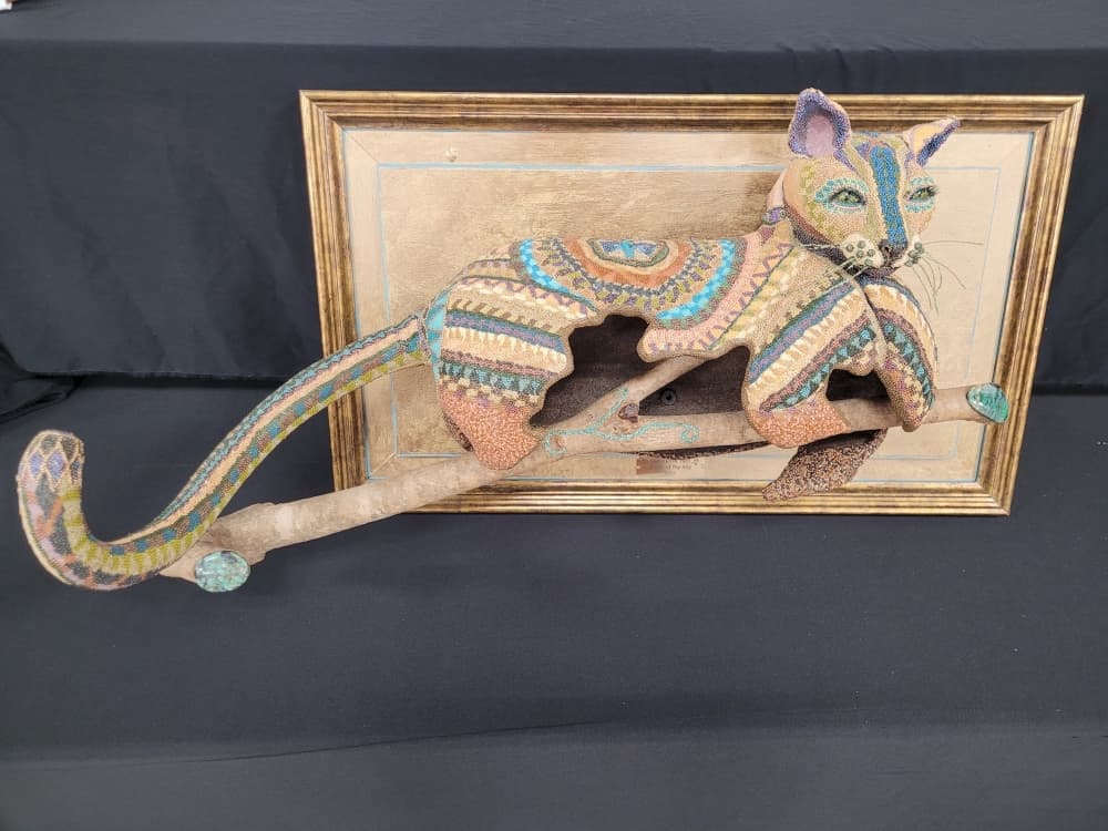 An image of gourd art which looks like a cat. 
