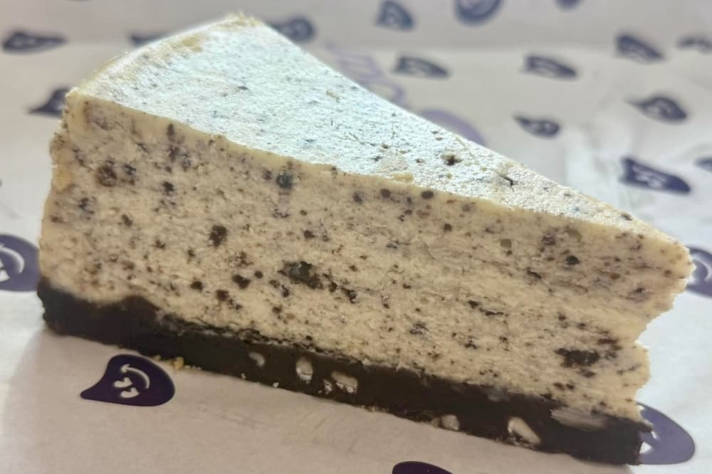 slice of cookies and creamy cheesecake