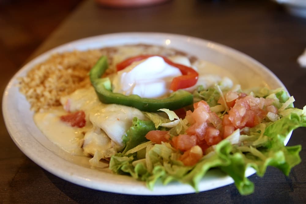 La Margarita serves a selection of enchiladas including the enchiladas de creama which are served with chopped chicken breast layered in a four pepper sour cream sauce, monteray jack cheese, a scoop of sour cream and bell peppers ($15.95). (Katlynn Fox/Community Impact)