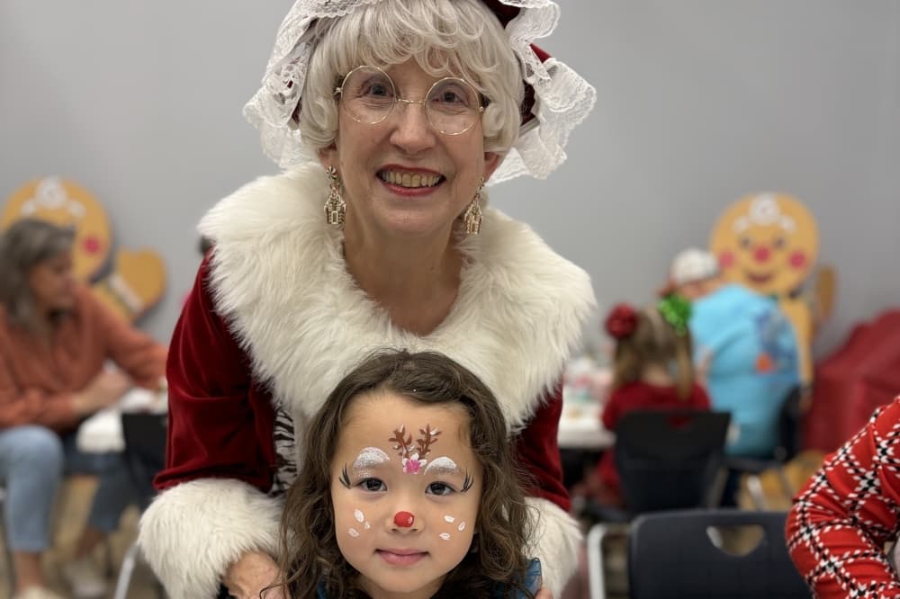 Mrs. Claus and a child