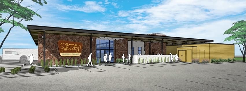A rendering is shown with a sign on the building featuring a lasso creating the word "shady" and a brown brick exterior.