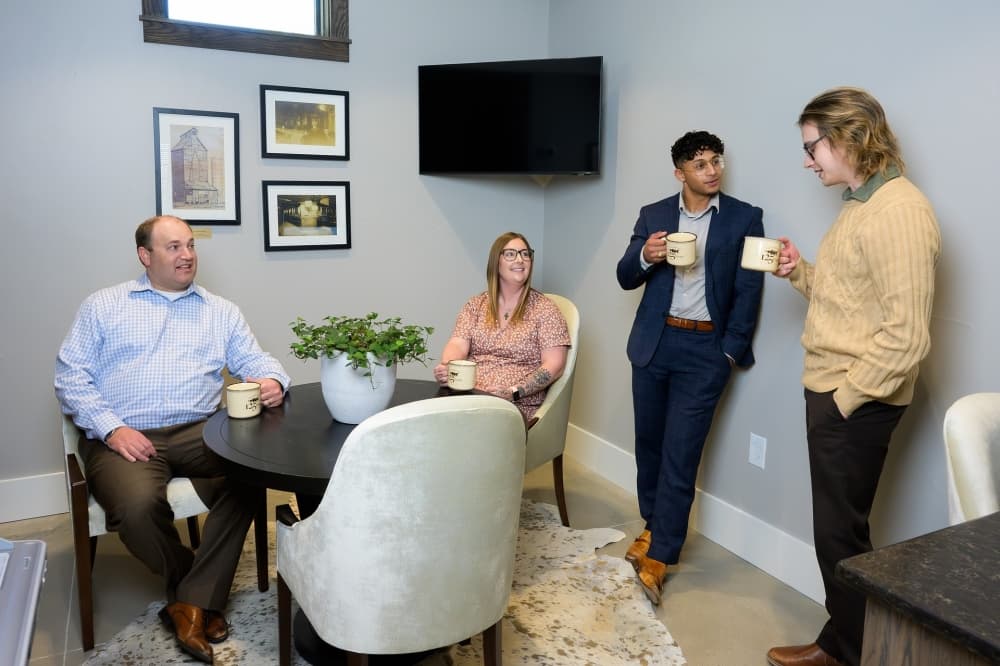 Hutto bankers talking around a table