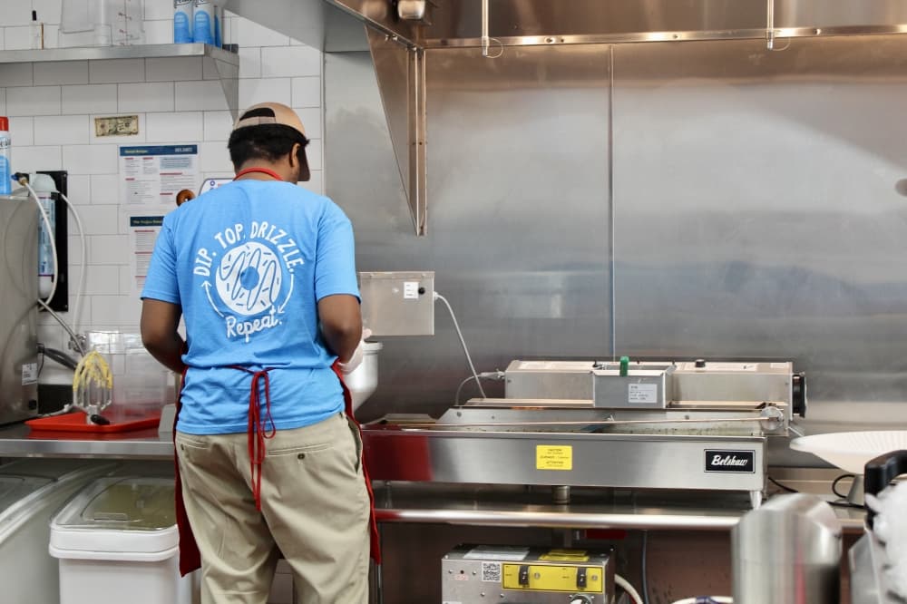 employee making donuts