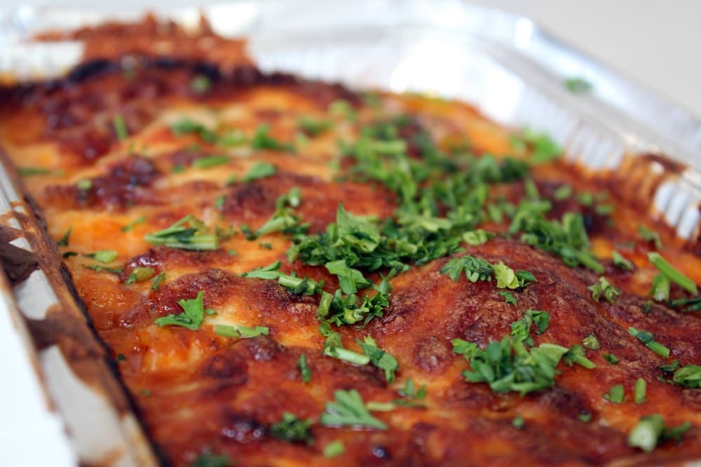 Aluminum pan filled with lasagna. 