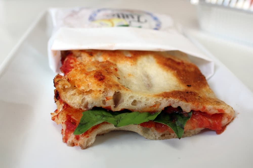 Folded over pizza crust filled with spinach and marinara sauce. 
