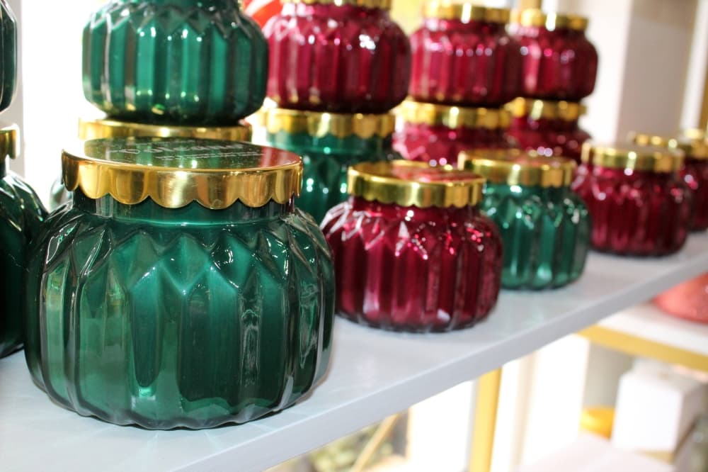 Candles in red and green jars. 