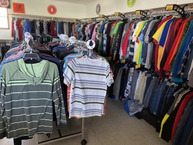 clothing racks filled with clothes