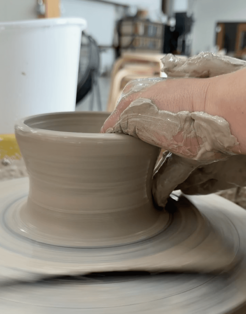 A person working on pottery