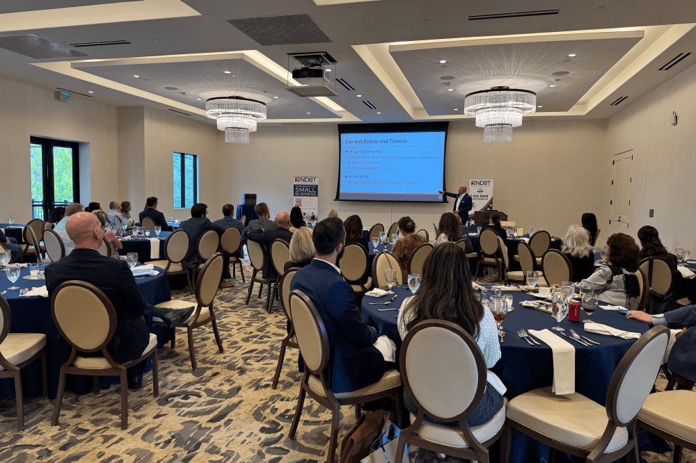 People sitting at cybersecurity education event Dallas