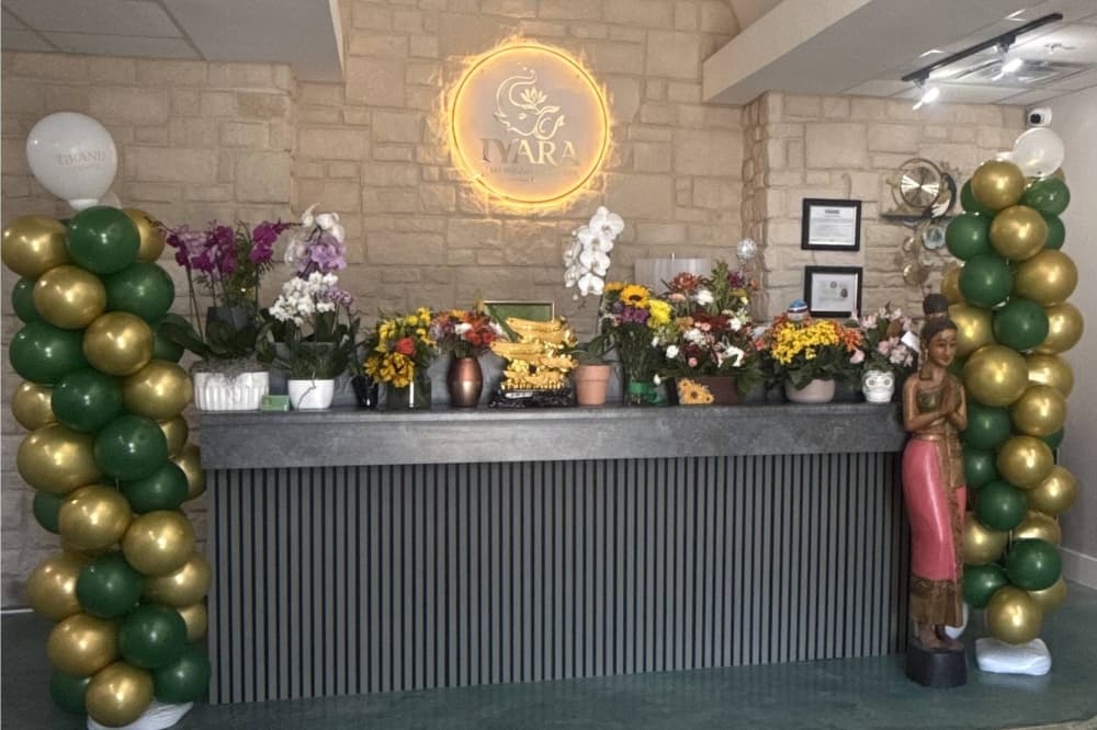 Interior of a business featuring Iyara signage and balloon art. 
