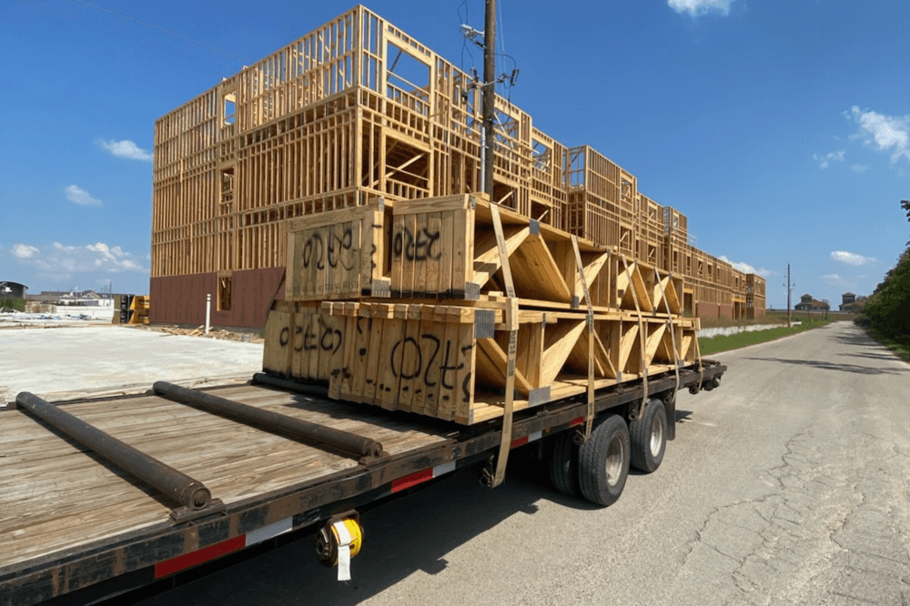 American Truss Components team assembling wooden trusses for residential construction