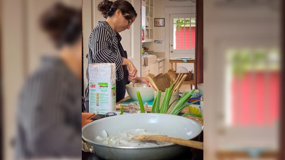 An adult cooking