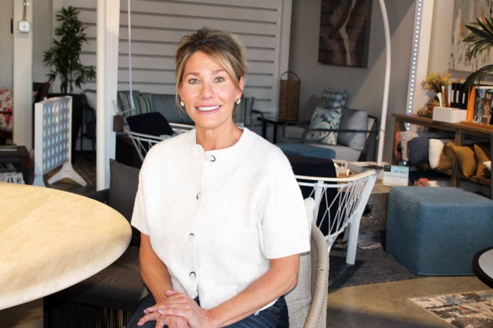 Female sitting in an outdoor furniture store. 