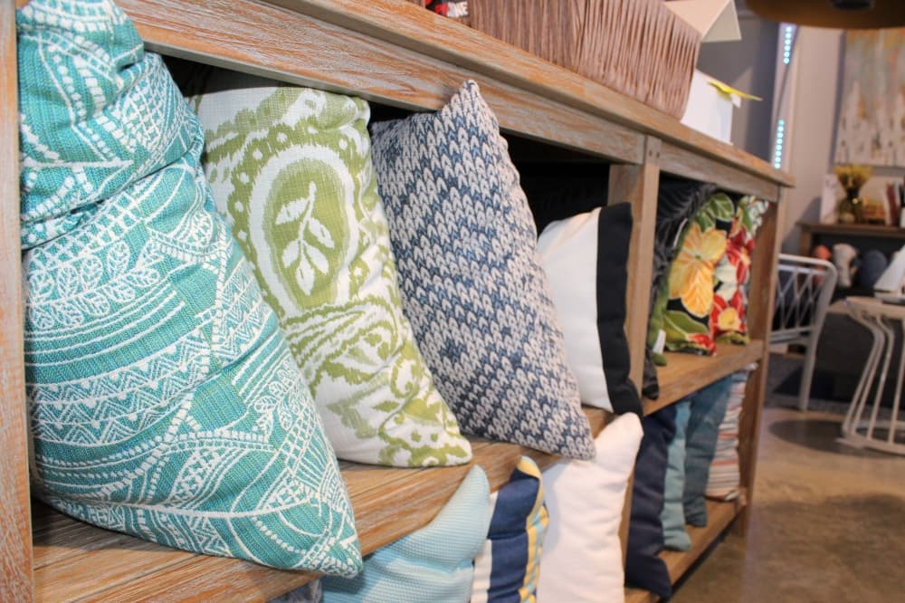 Variety of pillows featuring different fabrics. 