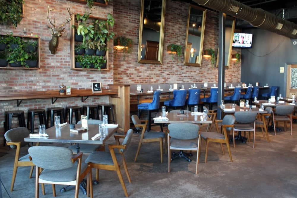 Interior of a restaurant with blue and brown design elements. 