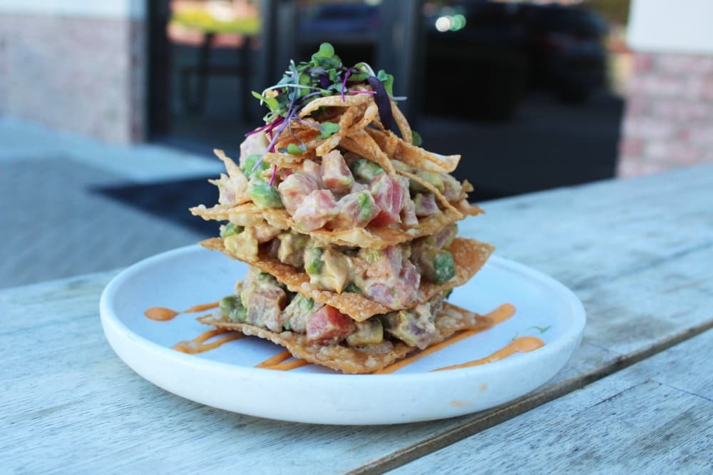 Layers of flat wontons topped with ahi tuna and other ingredients. 