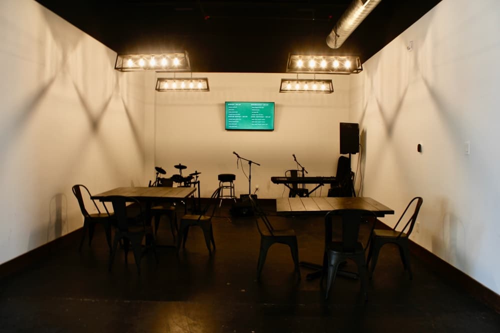 Live musical instruments with chairs and tables