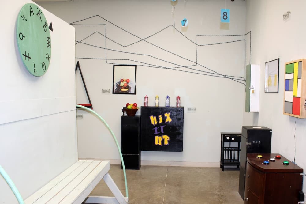 Room featuring a variety of puzzles on walls.