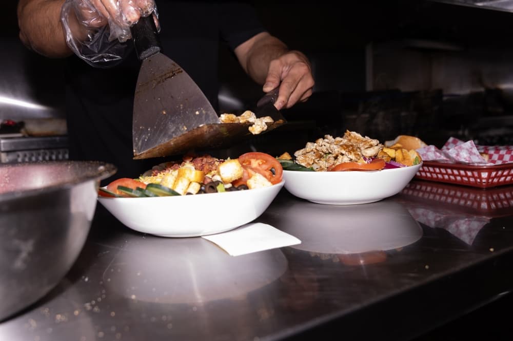 Salads having fresh chicken added by Uncle Tony's owner Tony Marron