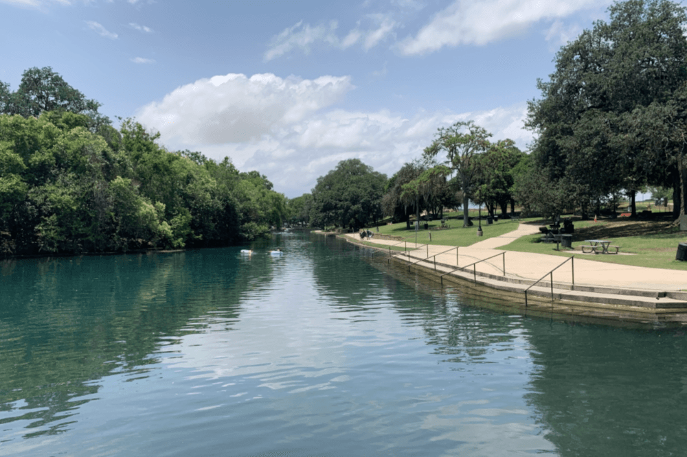 Beautiful outdoor park in New Braunfels, Texas featuring walking trails, playgrounds, and green spaces for families and visitors
