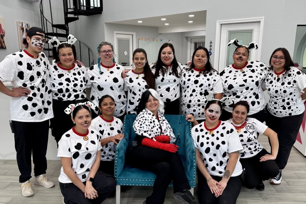 people dressed like dalmation dogs