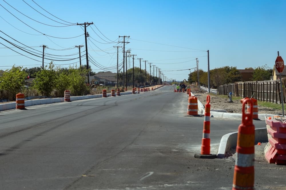 traffic cones on the sides of a road