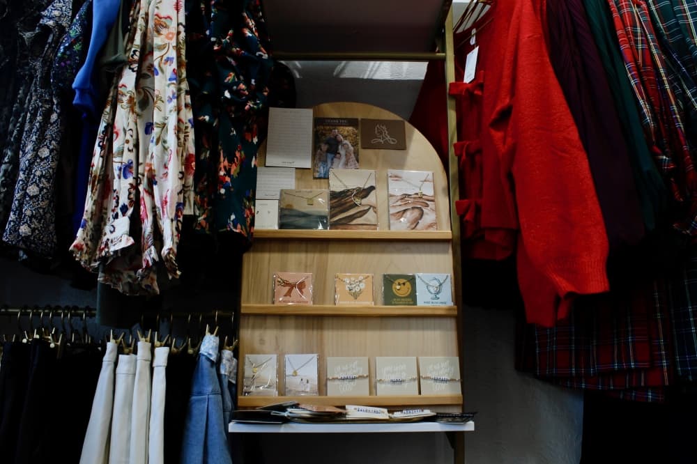 cards surrounded by clothes and dresses