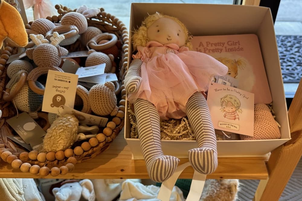 Box with rag doll and kids books