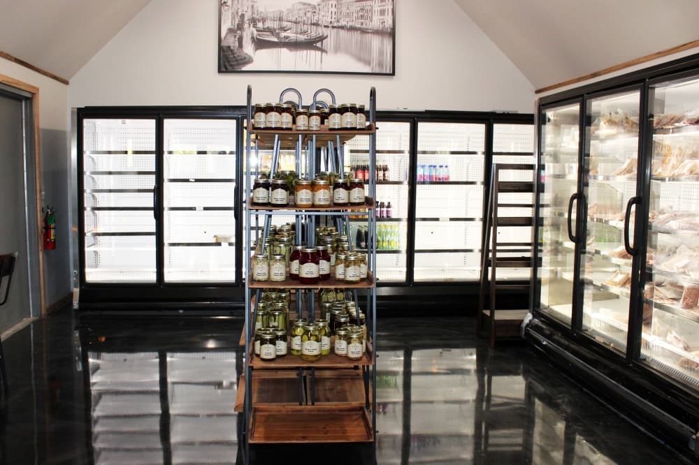 Market area featuring refrigerated section. 