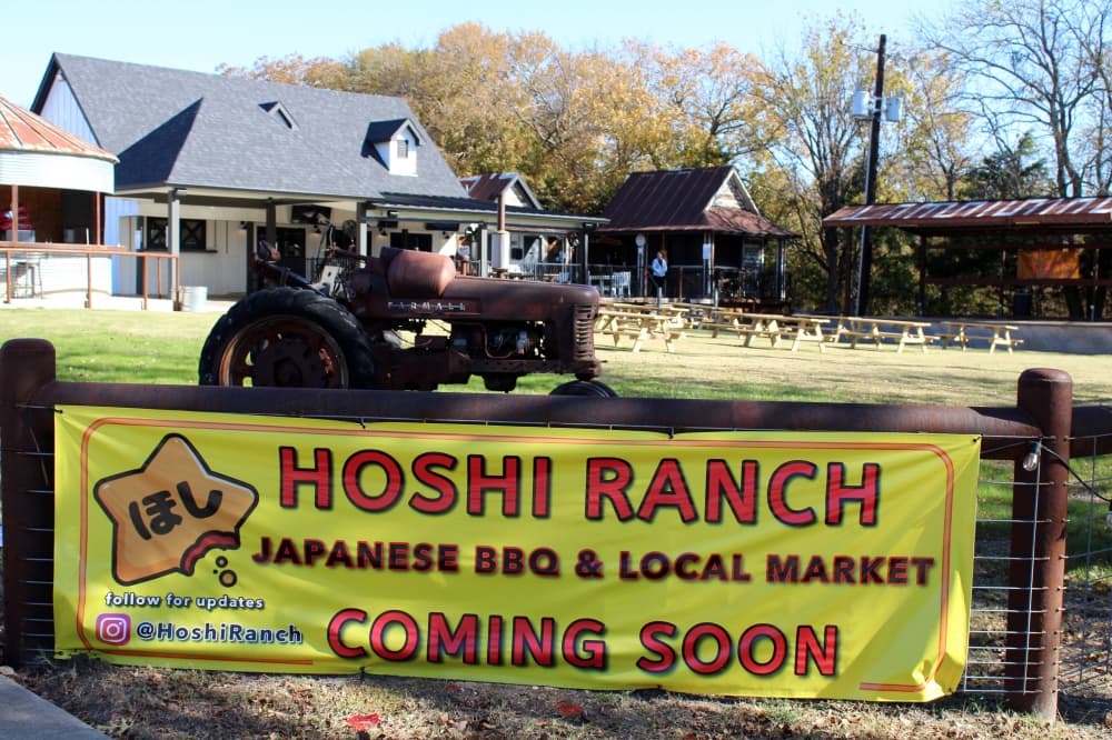 Banner on a fence featuring Hoshi Ranch Coming Soon message. 