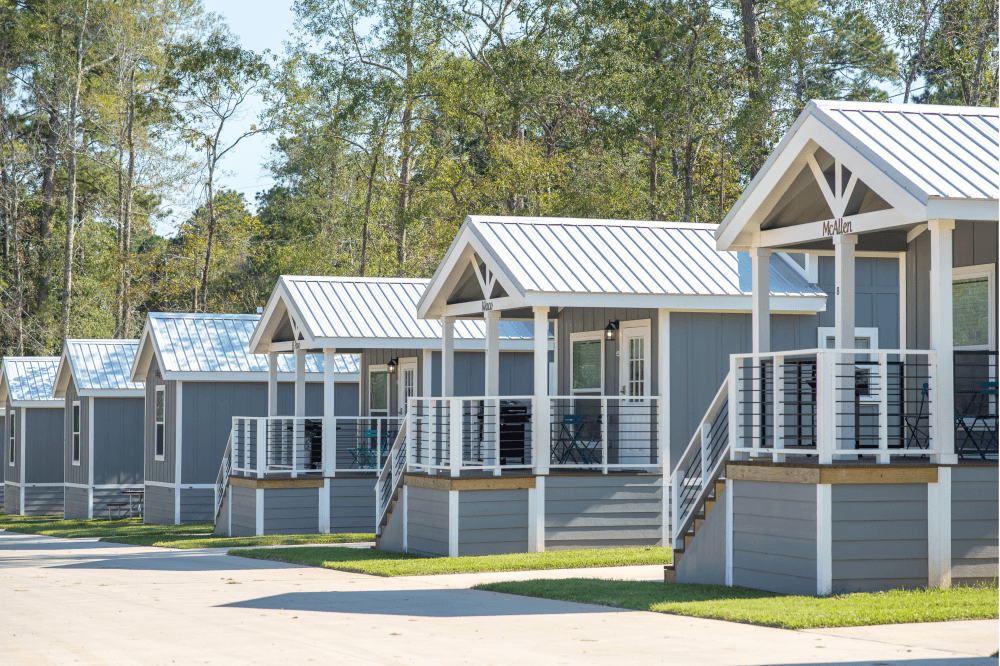 “Cozy, fully equipped cabin at The Retreat RV & Camping Resort decorated for Christmas, offering a family-friendly holiday vacation near Houston with modern comforts and lakeside views.”