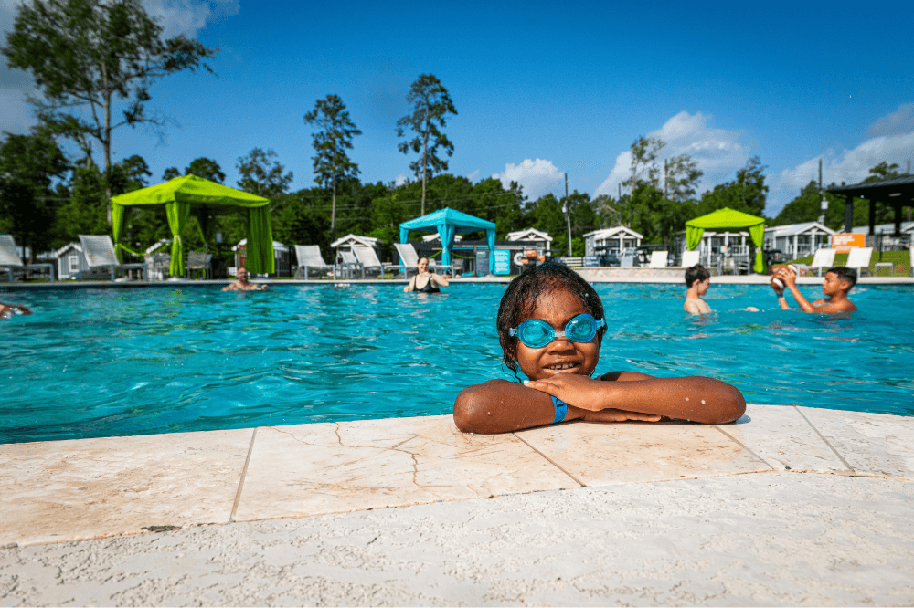 “Children participating in holiday crafts and ornament-making at The Retreat RV & Camping Resort during the Winter Wonderland celebration, one of the top family holiday activities near Houston.”